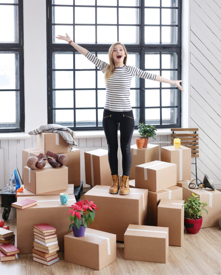 woman-with-cargo-packages-ready-shipping-moving-standing-laughing